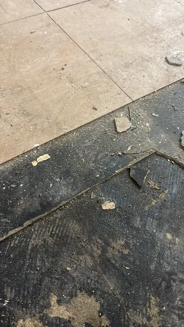 Black bitumen mastic floor removal in a SE25 flat